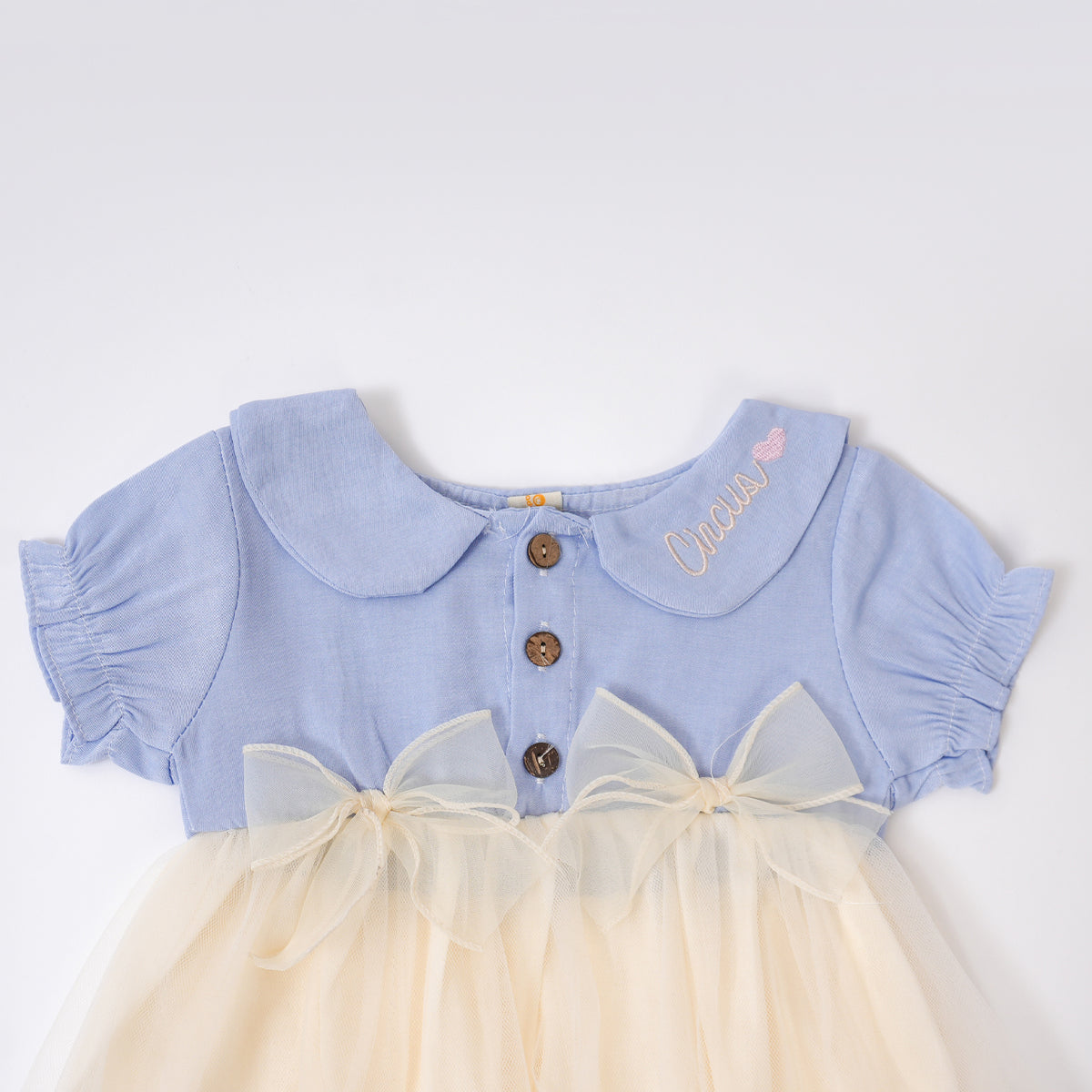 Bows and Buttons in Creamy Circus